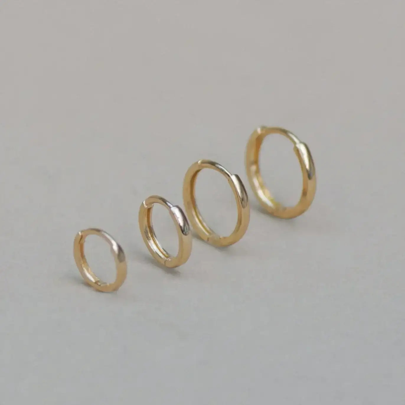 14K Solid Gold Seamless Huggie Hoop Earrings (Multiple Sizes) – Anygolds