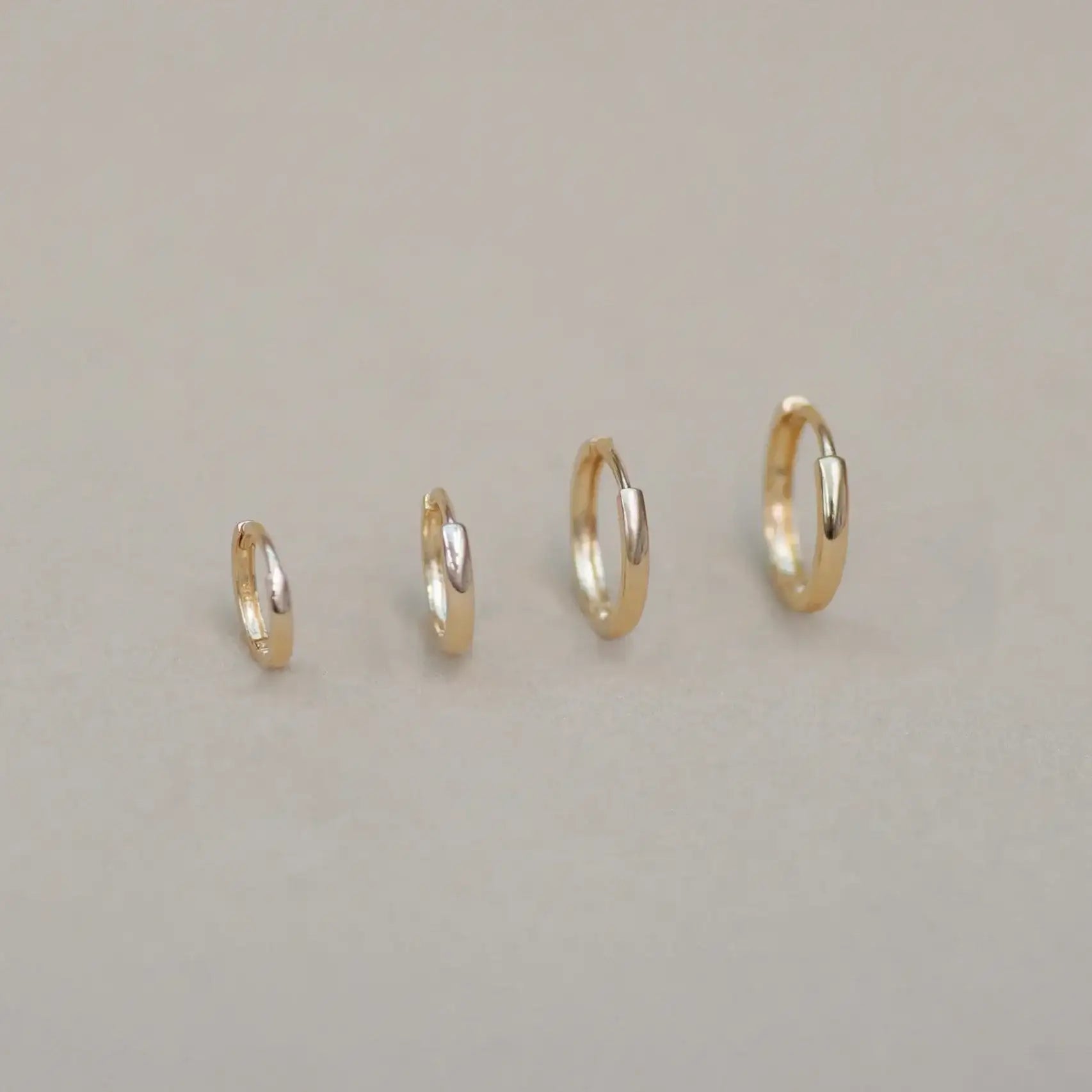 14K Solid Gold Seamless Huggie Hoop Earrings (Multiple Sizes) – Anygolds
