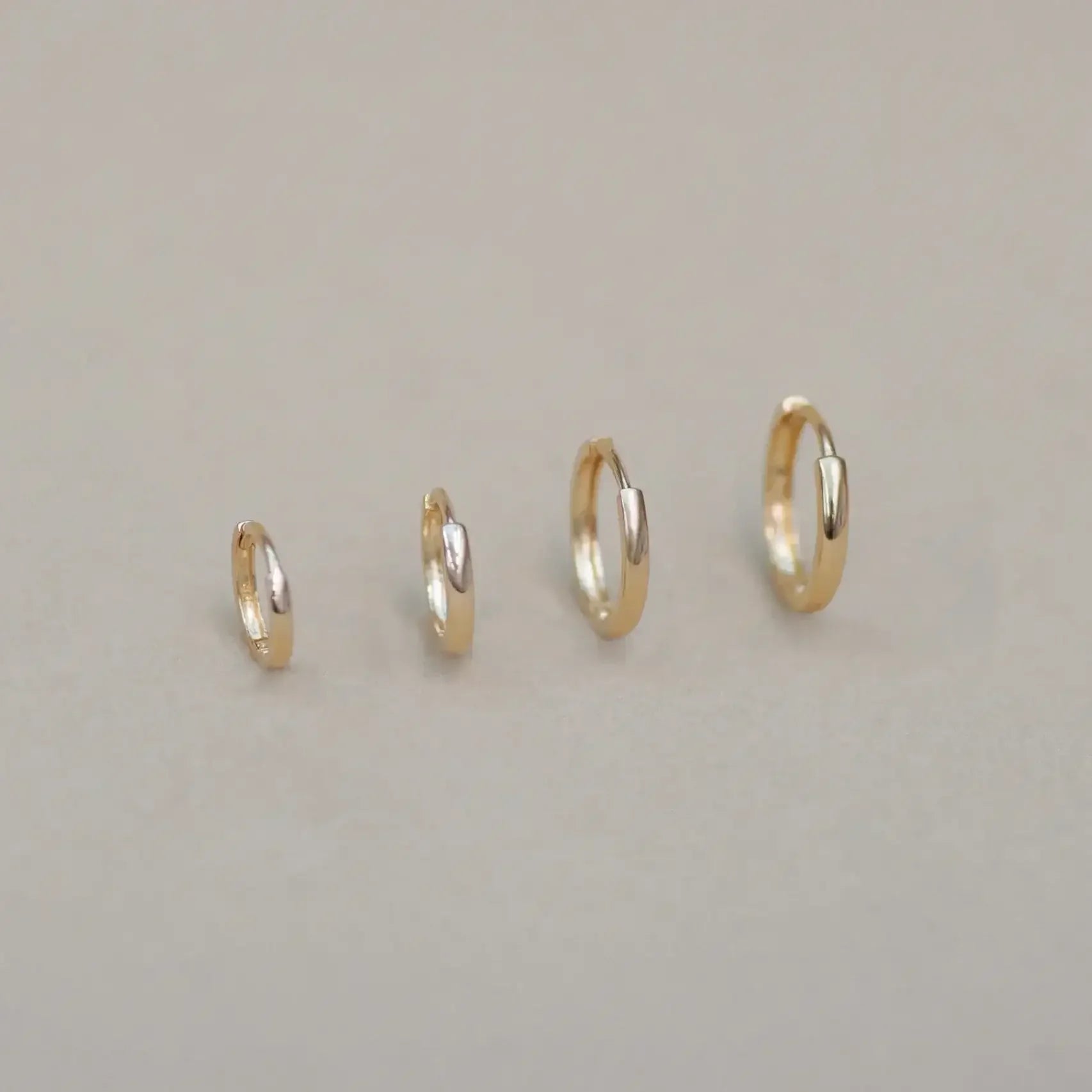 14K Solid Gold Seamless Huggie Hoop Earrings (Multiple Sizes) – Anygolds
